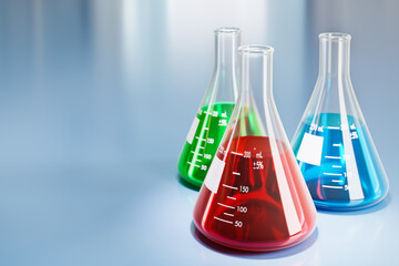 Erlenmeyer flasks with red, blue and green liquid in a laboratory.
