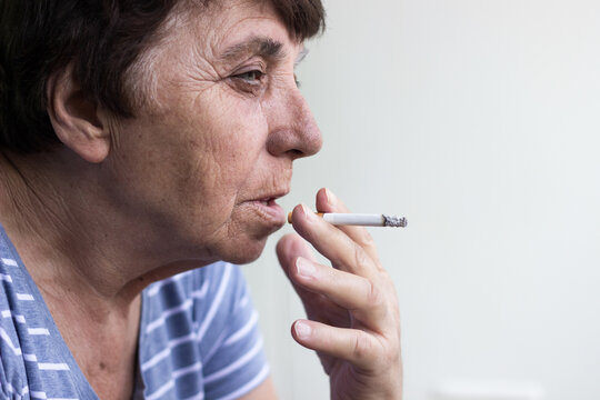 Senior woman smoking a cigarette