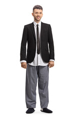 Full length portrait of a young modern businessman in a suit and pajamas