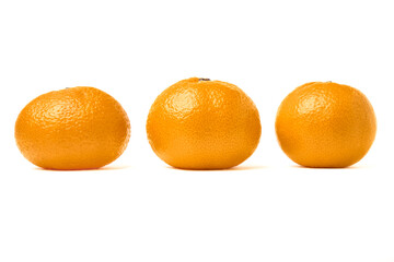 Three juicy tangerines lined up in a row. Isolated on a white background. Holiday mood.