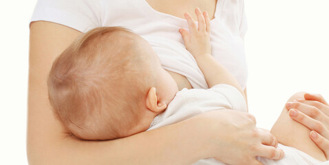 Obraz na płótnie Canvas Close up of mother breastfeeding her baby over a white background