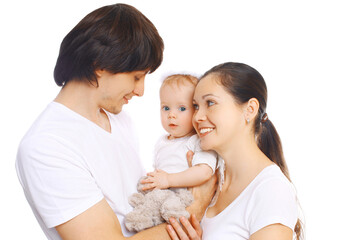 Family portrait of happy young mother, father and baby over a white background