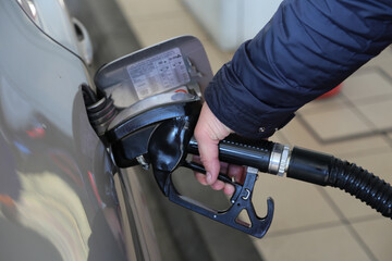 filing up car gas tank close up