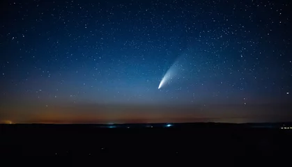 Foto op Canvas Wonderful view of starry sky and C/2020 F3 (NEOWISE) comet with light tail. © Leonid Tit