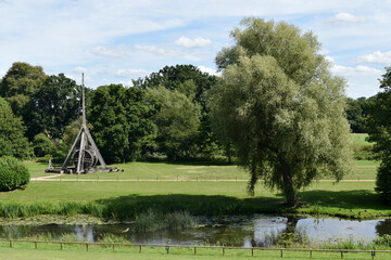 View of the fields with a wooden trebuchet and the River Avon from Warwick Castle grounds, Warwick,...