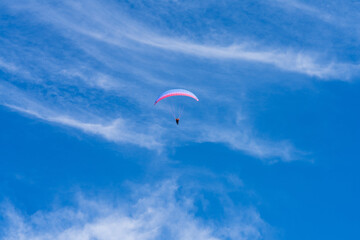 paragliding in the blue sky