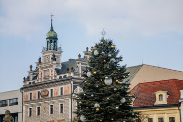 Fototapeta na wymiar Main town Charles' square with renaissance historical medieval town hall, Christmas tree in Kolin, Sgraffito wall decor on the facade, Central Bohemia, Czech Republic