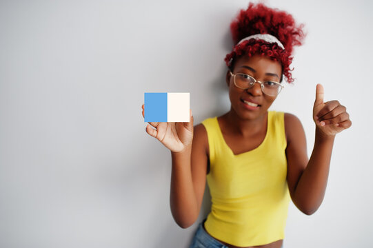 African woman with afro hair hold Kogi flag isolated on white background, show thumb up. States of Nigeria concept.