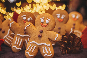 handmade biscuits: pastries in shape of ginger  men on New Year's background. Selective focus, noise effect