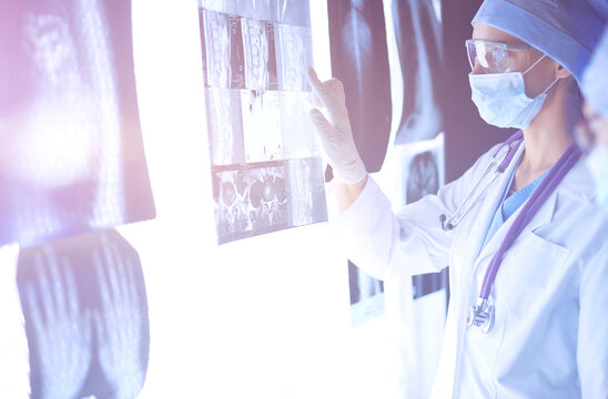 Two female women medical doctors looking at x-rays in a hospital