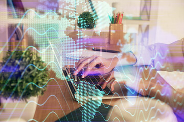 Double exposure of woman hands typing on computer and forex chart hologram drawing. Stock market invest concept.