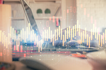 Double exposure of woman hands typing on computer and forex chart hologram drawing. Stock market invest concept.