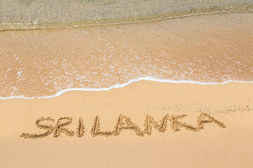 Fototapeta premium Sri Lanka written in a sandy