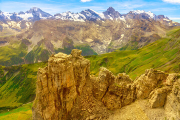 Aerial view above cliffs, rocky mountains and valleys with lakes and rivers at Birg to Schilthorn....