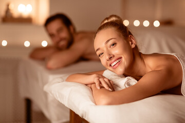 Obraz na płótnie Canvas Happy Lady Relaxing At Spa With Husband, Smiling Enjoying Aromatherapy