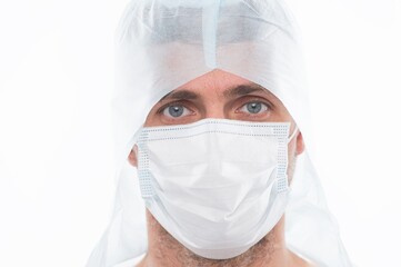 male doctor epidemiologist wearing respirator mask and safety protective costume during creating vaccine from coronavirus pandemic outbreak isolated on white, stay safe