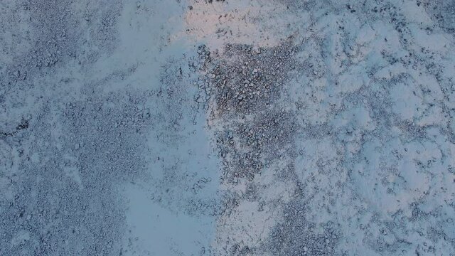 Drone Over Snow Covered Mountain Terrain