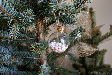 christmas tree decorations with pills hanging on the Christmas tree