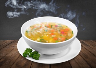 Bowl of delicious vegetable soup on a table