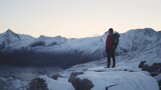 Mountaintop Hiker Looking At View