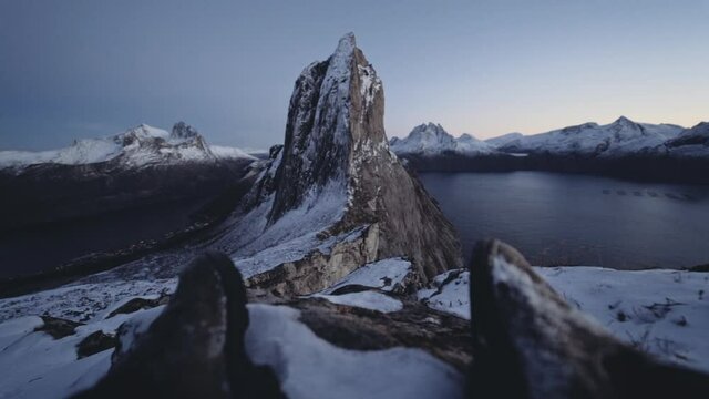 Hiker Resting With View Of Segla Mountain In Norway