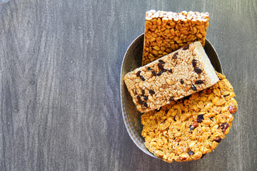 
Palanquetas, alegrias and dulce de leche, typical Mexican sweets made with amaranth, seeds and peanuts on gray vintage wooden background