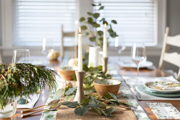 Beautiful holiday table setting with candles - 396438978