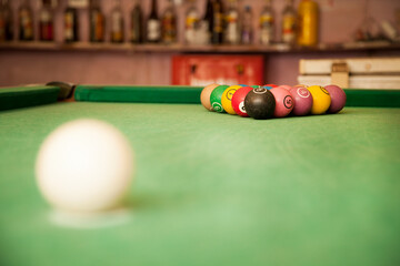 S&Atilde;O PAULO, BRAZIL - JAN 05, 2018:  Pool table with colored and numbered balls spread across the table in the snooker bar. Ready to play. game concept. Snooker concept. Billiard concept.