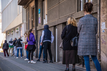Belgrade, Serbia. Coronavirus pandemic effects: long queue to enter the pharmacy store for shopping. Covid-19