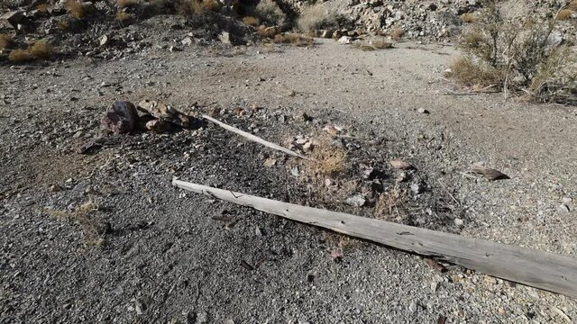Tilt up move over mine shaft head frame and ore chute in the nevada desert.
