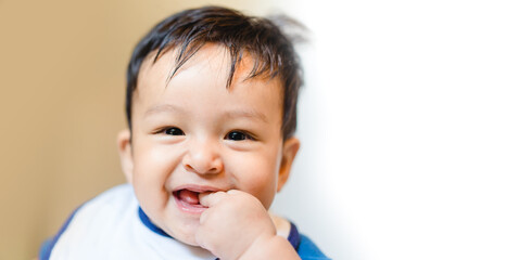 Adorable Mixed race caucasian asian baby kid boy smile be happy play with family.baby ready for first meal.infant 5 month baby boy smiling looking camera.handsome child.People family.Laughing boy.