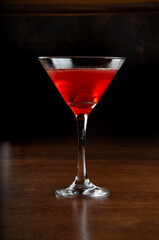 cosmopolitan cocktail in black background