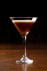 coffee cocktail in martini glass with black background