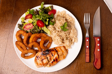 meal with grilled chicken, brown rice and salad