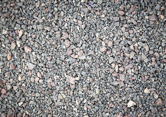 Abstract textured gray natural crushed stone background