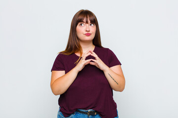 overweight woman scheming and conspiring, thinking devious tricks and cheats, cunning and betraying