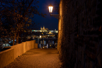 Fototapeta na wymiar timelapse illuminated prague castle and saint vitus church. view through the old illuminated castle fortress from the 17th century flowing river Vltavaat night in the center of Prague in Czech 