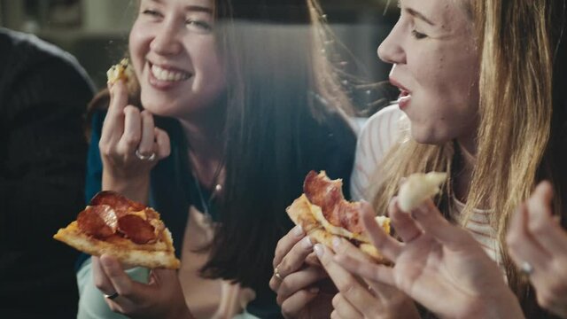 Happy Group Of Friends Sharing Pizza. Everybody Laughing, Chatting Having Great Time Together. One Girl Stealing Piece From Friend. Concept Of Millenials, Lifestyle, Indoors Leisure, Food.