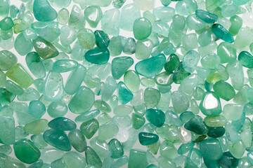 Small stones of green aventurine. Ornamental stone in the form of fine-grained pebbles