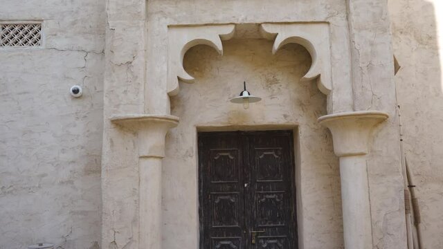 Frontage Exterior Of Restored Traditional Houses In Al Fahidi Historical Neighbourhood, Dubai UAE. - Tilt-Down Shot