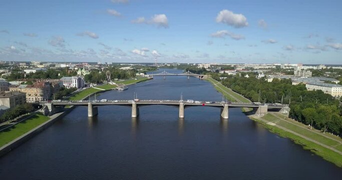 4K aerial video view of Tver town Volga River main watercourse with boats in the town center and bridges across the river on bright summer day some 180 km north-west of Moscow, Russia