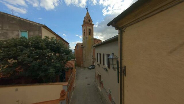 The church of San Cristoforo in Bettolle, Sinalunga, Tuscany. Italy, Fpv drone view. Traditional medieval village in the nature