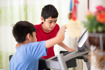 Teen boy running on treadmill for exercise