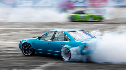 Blurred car drifting, Two car drifting battle on asphalt street road race track, Automobile and...