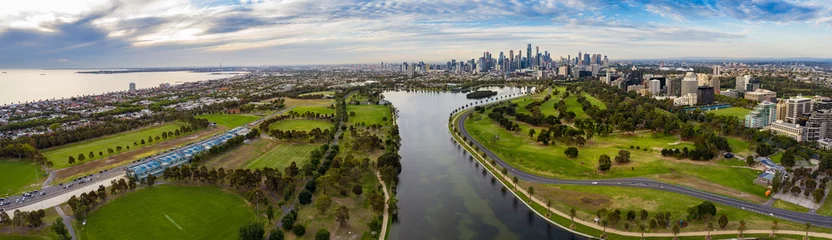 Deurstickers Panoramic view of the beautiful city of Melbourne as captured from above Albert Park Lake late in the afternoon © Michael Evans