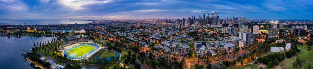 Panoramic view of the beautiful city of Melbourne as captured from above Albert Park Lake at sunset © Michael Evans