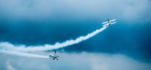 Fototapeta na wymiar civil jets maneuvering in the sky during an air parade