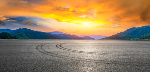 Asphalt road and green mountain natural landscape at sunset. © ABCDstock