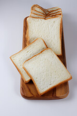 Sliced Toast Loaf White Bread (Shokupan or Roti Tawar) for Breakfast on White Background.