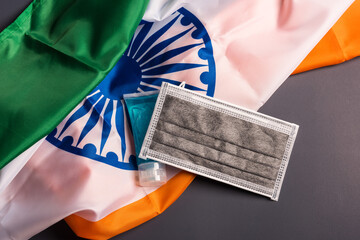Medical protective disposable face mask for cover mouth with India flag, studio shot on gray background, Safety healthcare medical prevent coronavirus or Covid-19